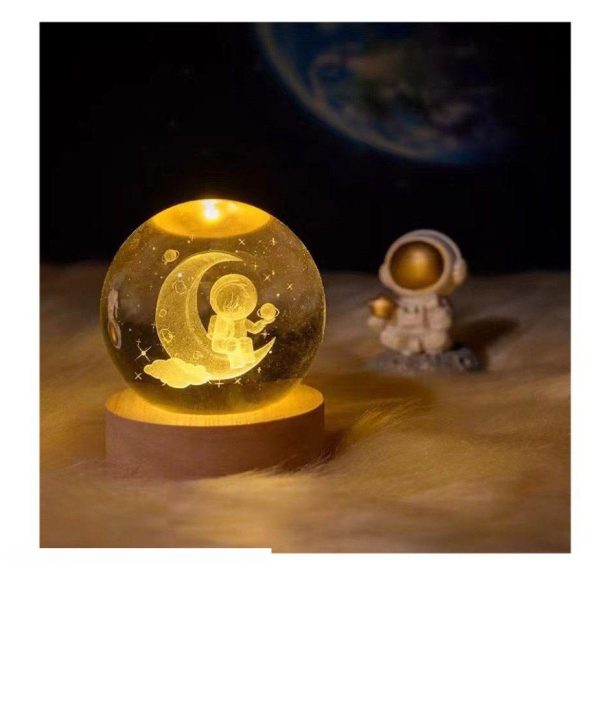 IMG-20250129-WA0103 گوی شیشه ای لیزری 10 سانتی - طرح فضانورد روی ماه - Image 1