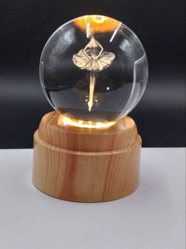 photo_8_2025-05-11_21-05-36 گوی لیزری چرخشی پایه طرح چوب بالرین روی پا - Image 1