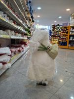 بابا نوئل خندان با کیسه و لباس سفید